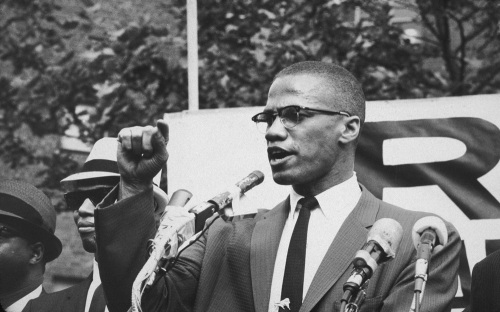 Malcolm X (1925 - 1965) at an outdoor rally, probably in New York City | Bob Parent/Hulton Archive/Getty Images)